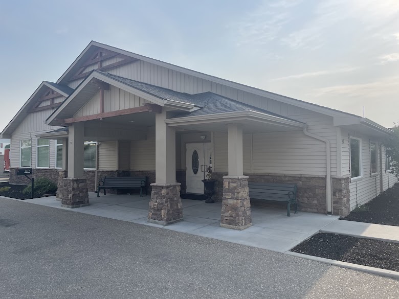 Welcoming main entrance of Copper Springs Senior Living with beautiful landscaping and accessible design
