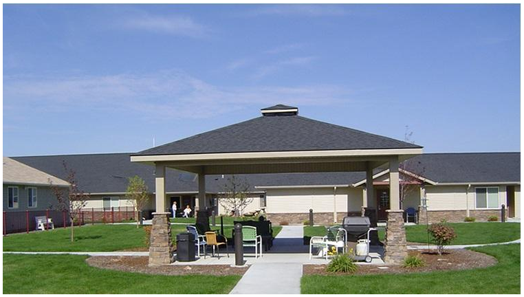 Beautiful outdoor gazebo and patio area with comfortable seating and landscaping